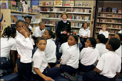 In celebration of National Library Week, Laura Bush visits the Martin Luther King Jr. Memorial Library and talks with fourth-graders from Maury Elementary School in Washington, D.C., Tuesday, April 12, 2005. During her visit to the library, Mrs. Bush read Oliver Butterworth's "The Enormous Egg" and introduced her Scottish Terrier Miss. Beazley to the students.