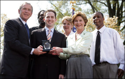President and Mrs. Bush stand with Jason Kamras, the 2005 National Teacher of the Year, after he was honored during ceremonies in the Rose Garden Wednesday, April 20, 2005. Joining them are Secretary of Education Margaret Spellings and former students Wendall Jefferson, left, and Marco Jeter.