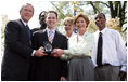 President and Mrs. Bush stand with Jason Kamras, the 2005 National Teacher of the Year, after he was honored during ceremonies in the Rose Garden Wednesday, April 20, 2005. Joining them are Secretary of Education Margaret Spellings and former students Wendall Jefferson, left, and Marco Jeter.