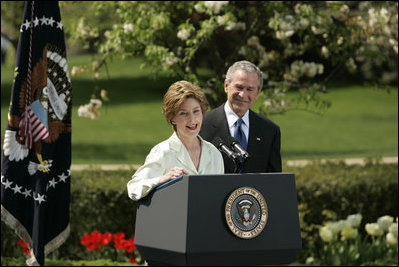 President George W. Bush looks on as he's introduced by First Lady Laura Bush Wednesday, April 20, 2005, to honor the 2005 National Teacher of the Year during ceremonies in the Rose Garden. Jason Kamras, a math teacher of eight years at John Philip Sousa Middle School in Washington, D.C., received the honors.