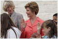 Laura Bush and Interior Secretary Gale Norton joins Guilford Elementary School students in taking the Junior Ranger pledge from National Park Service Director Fran Mainella during during an event at the Thomas Jefferson Memorial in Washington, D.C., April 21, 2005.