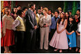 Laura Bush meets members of the Will Power to Youth program after watching their rendition of "Romeo and Juliet" at the Shakespeare Festival/LA in Los Angeles April 26, 2005. The program recruits children living below the poverty level to create their own versions of Shakespeare's plays, while paying them for their work and offering tutoring opportunities.