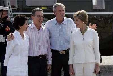 President George W. Bush and Colombian President Alvaro Uribe pose with their wives, U.S. first lady Laura Bush (R) and Colombia first lady Lina Moreno at the President's Central Texas ranch in Crawford, Texas, on August 4, 2005.