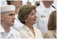 Laura Bush listens to President George W. Bush speak during a ceremony to commemorate the 60th anniversary of V-J Day at the Naval Air Station in San Diego, Calif., August 30, 2005.