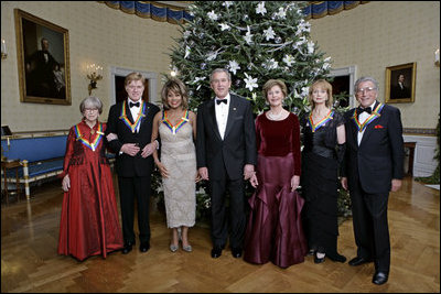 President George W. Bush and Laura Bush pose with the Kennedy Center honorees, from left to right, actress Julie Harris, actor Robert Redford, singer Tina Turner, ballet dancer Suzanne Farrell and singer Tony Bennett, Sunday, Dec. 4, 2005, during the reception in the Blue Room at the White House.