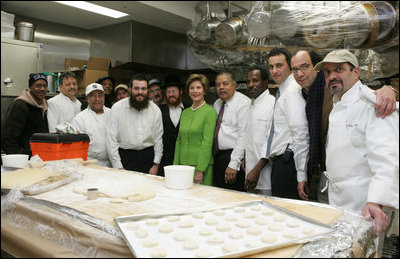 Mrs. Laura Bush is joined by Rabbi Binyomin Taub, Rabbi Hillel Baron and Rabbi Mendy Minkowitz as they stand with staff Tuesday, Dec. 6, 2005, during the kosherizing of the White House kitchen.