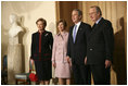 President George W. Bush and first lady Laura Bush are welcomed by King Albert II and Queen Paolo of Belgium at the palace office in Brussels, Monday, Feb. 21, 2005.