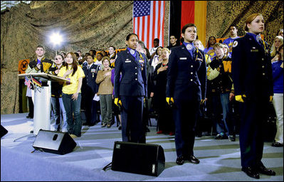 Students of General H. H. Arnold High School lead Mrs. Bush and the audience in the Pledge of Allegiance prior to her remarks Tuesday, Feb. 22, 2005, in Wiesbaden, Germany.