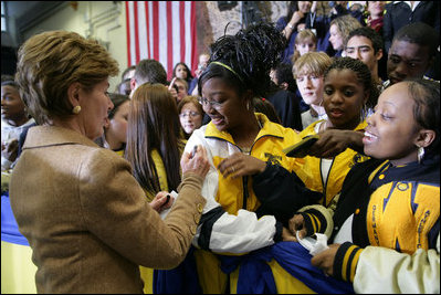 Laura Bush signs autographs for students of General H. H. Arnold High School following her remarks there to students, faculty and parents of the military in Wiesbaden, Germany, Tuesday, Feb. 22, 2005.