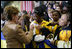 Laura Bush signs autographs for students of General H. H. Arnold High School following her remarks there to students, faculty and parents of the military in Wiesbaden, Germany, Tuesday, Feb. 22, 2005.