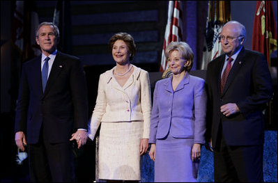 President George W. Bush stands with Laura Bush, Lynne Cheney and Vice President Dick Cheney during the pre-inaugural event "Saluting Those Who Serve" at the MCI Center in Washington, D.C., Tuesday Jan. 18, 2005.