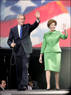 President George W. Bush and Laura Bush wave to young supporters during the pre-inaugural event 'America's Future Rocks Today- A Call to Service' youth event at the DC Armory in Washington, D.C., Tuesday, Jan. 18, 2005. The event highlighted the importance of volunteerism and community service in America's neighborhoods.