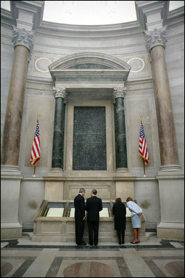 President George W. Bush and Laura Bush view the U.S. Constitution with National Archivist John Carlin, second on left, and Senior Curator Stacy Bredhoff, second on right, while touring the National Archives in Washington, D.C., Wednesday, Jan. 19, 2005. The Bushes also looked at the Declaration of Independence, George Washington's handwritten inaugural address, George Washington and President George H. W. Bush's inaugural Bible, and the Bill of Rights.