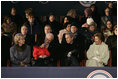 President George W. Bush and Laura Bush sit with Vice President Dick Cheney, Lynne Cheney, and their granddaughter, Grace Perry, during a concert commemorating the 55th Presidential Inauguration on the Ellipse in Washington, D.C., Wednesday, Jan. 19, 2005.