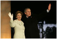 President George W. Bush and Laura Bush arrive on stage for a fireworks display during the inaugural concert 'A Celebration of Freedom' on the Ellipse south of the White House, Wednesday, Jan. 19, 2005.