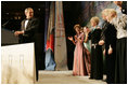 After an introduction by Vice President Dick Cheney, President George W. Bush talks at the Black Tie and Boots Inaugural Ball in Washington, D.C., Wednesday, Jan. 19, 2005. Also pictured are, from left, Jenna Bush, Barbara Bush, Laura Bush, Congresswoman Kay Granger, Vice President Cheney and Lynne Cheney.