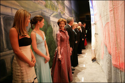 Laura Bush shares a private moment with her twin daughters Jenna, left, and Barbara before walking on stage for the Texas State Society's Black Tie and Boots Inaugural Ball in Washington, D.C., Wednesday, Jan. 19, 2005. Also pictured are, from left, President George W. Bush, Texas Congresswoman Kay Granger, Vice President Dick Cheney, Lynne Cheney, Texas Sen. John Cornyn, and Texas Gov. Rick Perry.