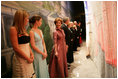 Laura Bush shares a private moment with her twin daughters Jenna, left, and Barbara before walking on stage for the Texas State Society's Black Tie and Boots Inaugural Ball in Washington, D.C., Wednesday, Jan. 19, 2005. Also pictured are, from left, President George W. Bush, Texas Congresswoman Kay Granger, Vice President Dick Cheney, Lynne Cheney, Texas Sen. John Cornyn, and Texas Gov. Rick Perry.