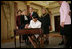 Secretary of State Dr. Condoleezza Rice signs official papers Friday, Jan. 28, 2005, after receiving the oath of office during her ceremonial swearing in at the Department of State. Watching on are, from left, Laura Bush, Justice Ruth Bader Ginsburg, President George W. Bush and an unidentified family member.