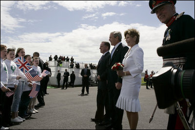 President George W. Bush and Laura Bush are greeted by ceremony and cheers upon their arrival at Glasgow Prestwick International Airport in Scotland July 6, 2005.