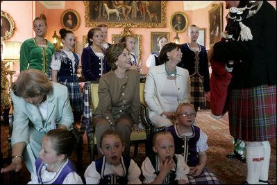 First Lady Laura Bush sits with Cherie Blair and Sheila Martin, left, during a cocktail reception and dinner Thursday, July 7, 2005 at the Gleneagles Hotel in Auchterarder, Scotland.