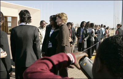 First Lady Laura Bush poses for pictures upon her departure Monday, July 11, 2005 at Gaborone International Airport in Gaborone, Botswana.