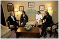 President George W. Bush, Bono, Laura Bush and Bob Geldof, far right, hold a working meeting on Africa at the G8 Summit in Gleneagles, Scotland, Wednesday, July 6, 2005.