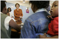 Laura Bush visits with women involved with the program, "Mothers to Mothers-to-Be," in Cape Town, South Africa, Tuesday, July 12. The program provides counseling, education and support to HIV/AIDS infected women during pregnancy.