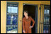 Laura Bush pauses in a doorway during an interview with Ann Curry of The Today Show at Philani, Tuesday July 12, 2005, in Cape Town, South Africa.