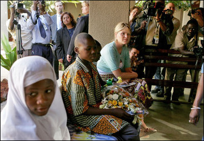 Jenna Bush listens to children with HIV/AIDS at PASADA in Dar es Salaam, Tanzania, Wednesday, July 13, 2005. "PASADA trains caregivers to provide home-based care for people living with AIDS. PASADA also provides support to orphans and other vulnerable children - boys and girls who have lost one or both of their parents to AIDS. These children need help with all the challenges that come with growing up - and with the responsibilities that an adult would usually handle," said Mrs. Bush in her comments.