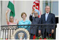 President Bush stands with India's Prime Minister Dr. Manmohan Singh, Laura Bush and Singh's wife, Mrs. Gursharan Kaur, Monday, July 18, 2005 during the Prime Minister's official visit to the White House.