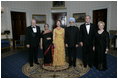 President George W. Bush and Laura Bush with Prime Minister Manmohan Singh of India and Mrs. Gursharan Kaur, before dinner in honor of their official visit Monday, July 18, 2005, at the White House. With Vice President Dick Cheney and Lynne Cheney.