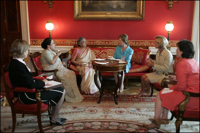 Laura Bush and Mrs. Gursharan Kaur, wife of India's Prime Minister Dr. Manmohan Singh, meet for coffee Monday, July 18, 2005, during an official visit to the White House.