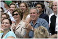 President George W. Bush and Mrs. Laura Bush cheer on players during a Tee Ball game on the South Lawn of the White House between the District 12 Little League Challengers from Williamsport, PA and the West University Little League Challengers from Houston, Texas on Sunday July 24, 2005.