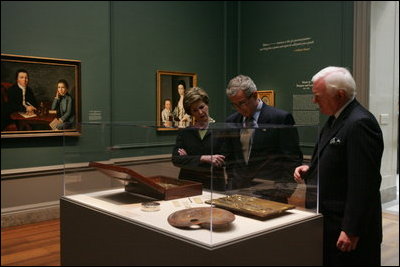 President and Mrs. Bush receive a tour of the Gilbert Stuart Exhibition at the National Gallery of Art, from gallery director Earl " Rusty" Powell III, Monday, July 25, 2005 in Washington.