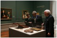 President and Mrs. Bush receive a tour of the Gilbert Stuart Exhibition at the National Gallery of Art, from gallery director Earl " Rusty" Powell III, Monday, July 25, 2005 in Washington.
