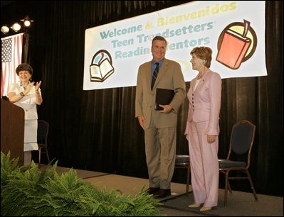 Laura Bush and her brother-in-law Florida Gov. Jeb Bush are applauded upon their arrival at the Teen Trendsetters Reading Mentors 2005 Annual Summit, July 26, 2005 at the Wyndham Orlando Resort in Orlando, Florida.