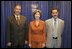 Laura Bush visits with Talib Aziz M. Zaini, Minister of Youth and Sports for Iraq, left, and Abbas Kadim Ibrahim, Director General, Ministry of Youth and Sports for Iraq, at the National Youth Summit in Washington, D.C., Friday, July 29, 2005. The Iraqi officials attended the summit to increase their understanding of youth development.