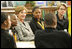 Laura Bush attends the Helping America's Youth Event at the Benjamin S. Carson Honors Preparatory School, Atlanta, Georgia, March 9, 2005, visiting a debate class with U.S. Education Secretary Margaret Spellings.