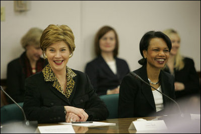Laura Bush and Secretary of State Condoleezza Rice laugh during a roundtable discussion with women leaders from around the world held in honor of International Women's Day at the State Department in Washington, D.C. Tuesday, March 8, 2005. Today in her remarks at the State Department Mrs. Bush said, "We all have an obligation to speak for women who are denied their rights to learn, to vote or to live in freedom. We may come from different backgrounds, but advancing human rights is the responsibility of all humanity, a commitment shared by people of goodwill on every continent."