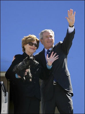 Mrs. Bush holds onto Miss Beazley Monday, March 28, 2005, as she and President George W. Bush wave goodbye upon boarding Air Force One in Waco, Texas, en route home to Washington D.C.