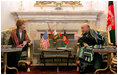 Afghan President Hamid Karzai jokes with Laura Bush during a meeting in the Presidential Palace in Kabul, Afghanistan Wednesday, March 30, 2005.