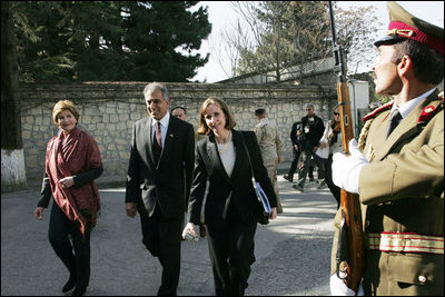 Laura Bush arrives at the Presidential Palace accompanied by U.S. Ambassador to Afghanistan Zalmay Khalilzad and Under Secretary of State for Global Affairs Paula Dobriansky in Kabul, Afghanistan Wednesday, March 30, 2005.