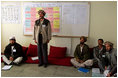 A man studying to be a teacher stands to introduce himself during a visit by Mrs. Bush to Kabul University in Kabul, Afghanistan, Wednesday, March 30, 2005.