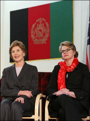 Laura Bush and U.S. Secretary of Education Margaret Spellings are seated together onstage at Kabul University Wednesday, March 30, 2005 in Kabul, Afghanistan. Mrs. Bush and Secretary Spellings toured the Women’s Teacher’s Training Institute and the National Women’s Dormitory prior to Mrs. Bush's announcement of the United States' commitment to provide more than 15 million dollars in funds for building a new university in Kabul.