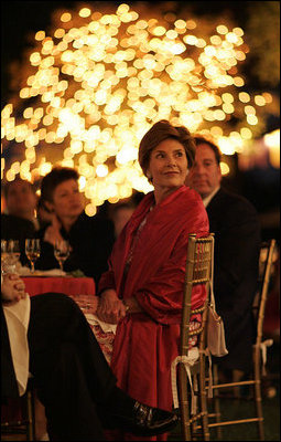 Laura Bush listens to a mariachi band perform during the White House celebration of Cinco de Mayo songs in the Rose Garden of the White House Wednesday, May 4, 2005.