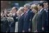 President George W. Bush and Laura Bush stand with Russian President Vladimir Putin and Lyudmila Putina, French President Jacque Chirac, far left, and Chinese President Hu Jintao, right, as many heads of state watch a parade in Moscow's Red Square commemorating the end of World War II Monday, May 9, 2005.