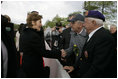 First Lady Laura Bush shakes hands with a veteran following a ceremony Sunday, May 8, 2005, in Margraten, Netherlands honoring those who served in World War II. The ceremony highlighted the President and First Lady’s visit to the Netherlands before moving on to Moscow.