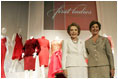 Laura Bush and Nancy Reagan appear at the opening Thursday, May 12, 2005, of The Heart Truth's First Ladies Red Dress Collection exhibit at the John F. Kennedy Center for the Performing Arts in Washington D.C.