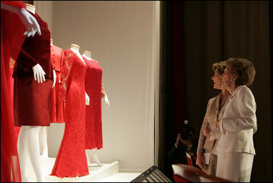 Laura Bush and Nancy Reagan view part of The Heart Truth’s First Ladies Red Dress Collection on exhibit Thursday, May 12, 2005, at the John F. Kennedy Center for the Performing Arts in Washington D.C.